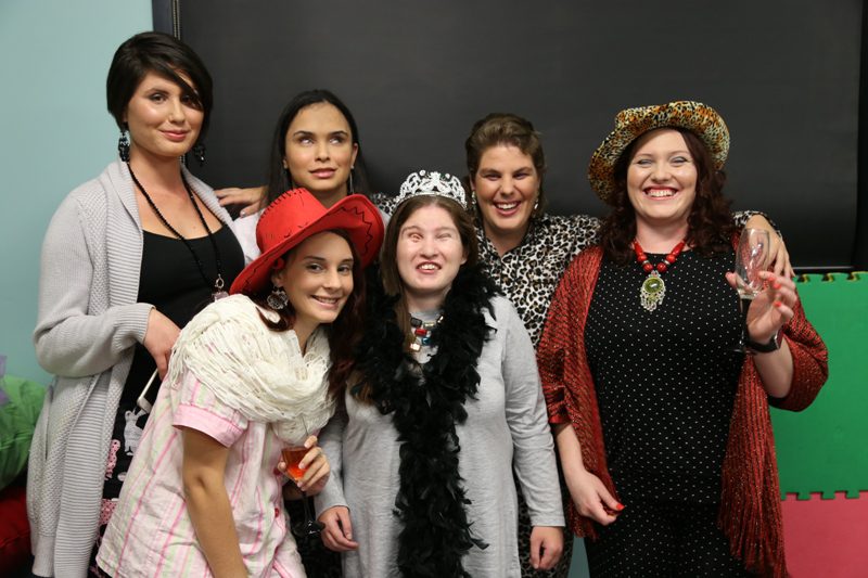 Image of a group of six women dressed up in fun outfits