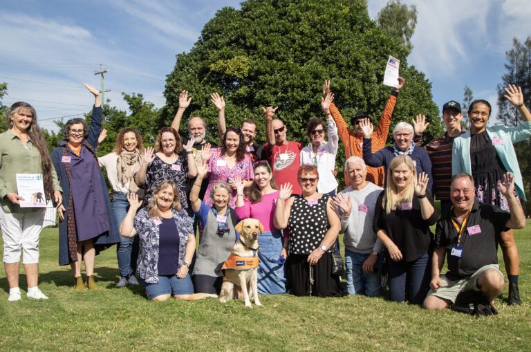 Image shows the 3-year volunteer group photo with Ambassador Dog Vanda