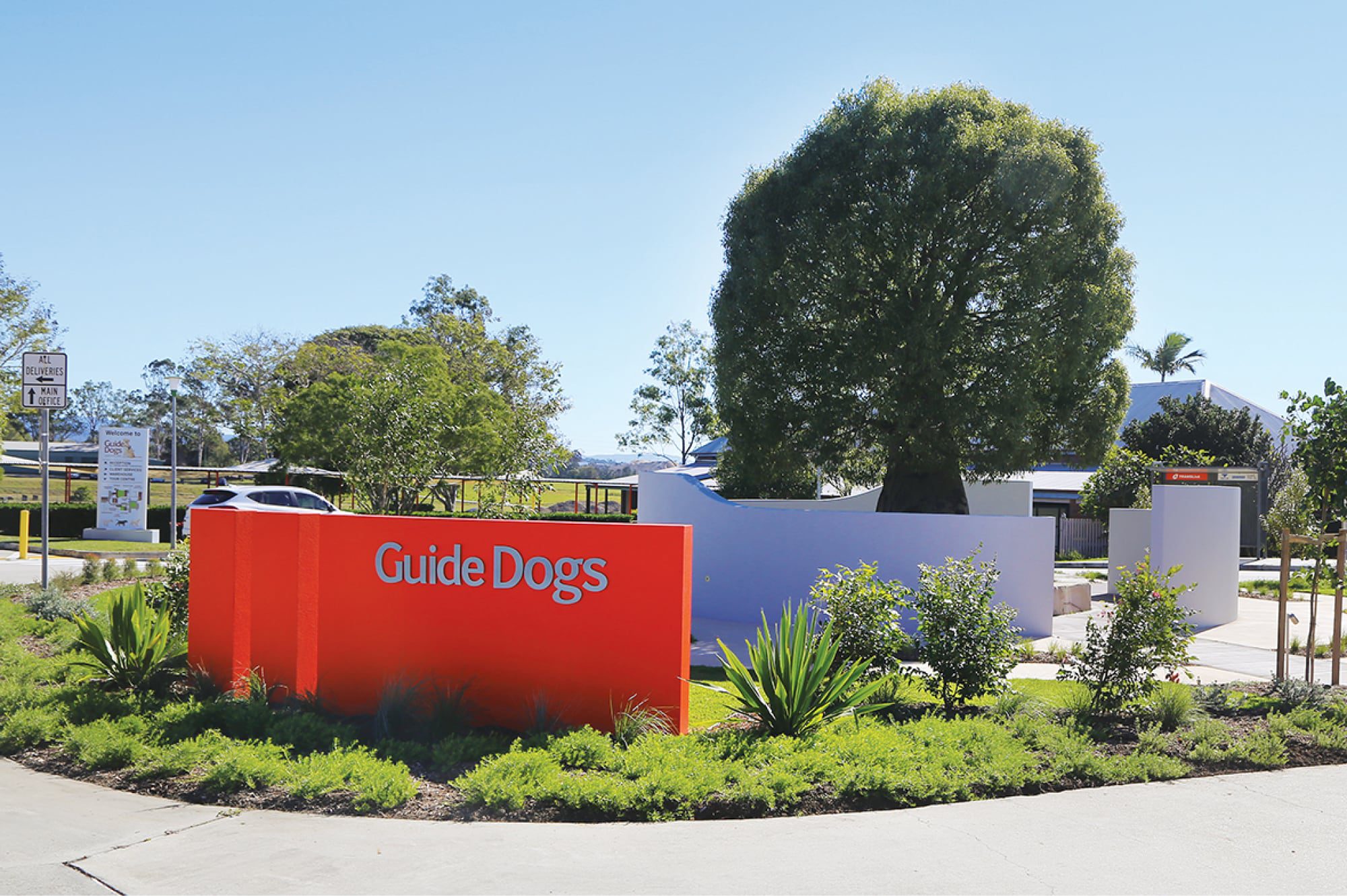 Garden with a Guide Dogs sign in it.
