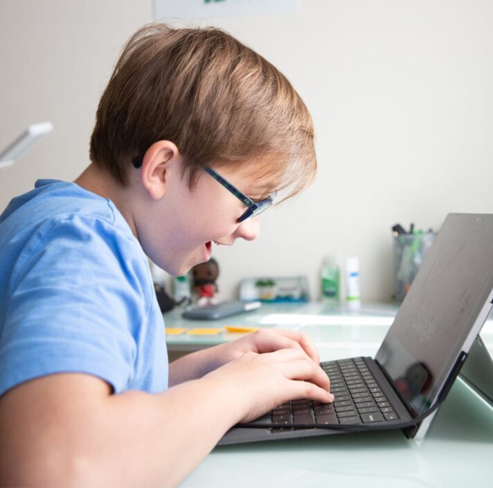 Image of young boy on laptop