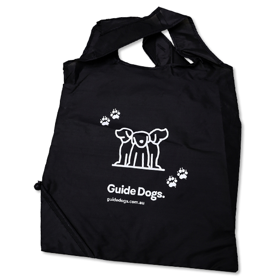 Image of flat black shopping bag with guide dogs logo